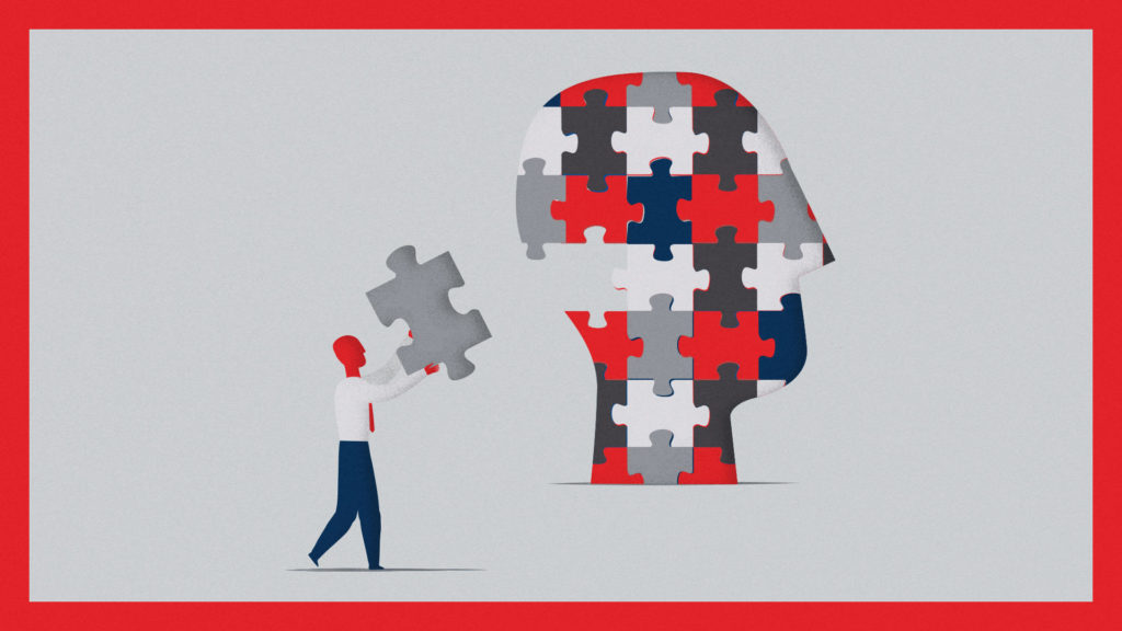 A person placing the last piece of a head-shaped jigsaw coloured using the Time Magazine brand palette