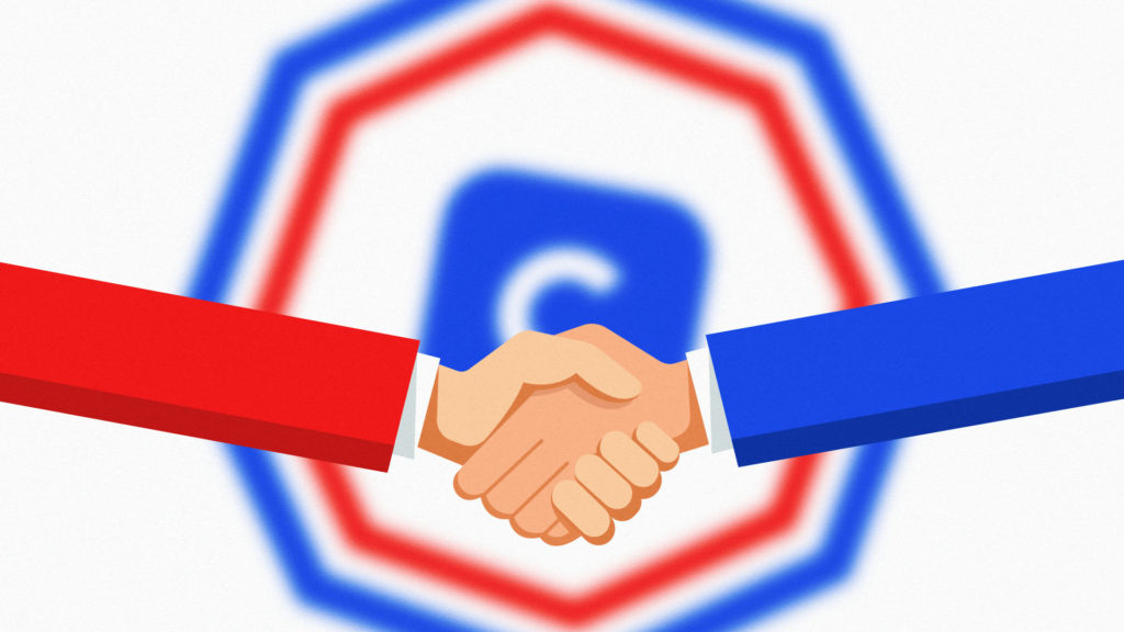 Two people shaking hands in front of a Coinbase logo sitting inside a CFTC logo