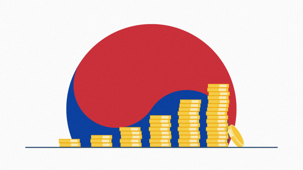 South Korean flag behind a stack of coins representing altcoins